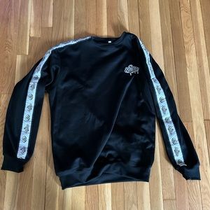 New in the bag black sweatshirt sealed in package. 
Size Large